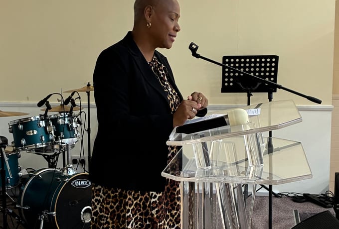 Sharon-Ann Phillips, founder of Heartbreak to Hope, speaking at the Macmillan Coffee Morning, True Vine Ministries, Lambeth