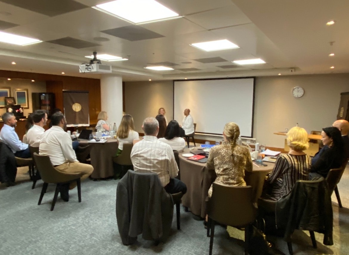 Colleagues gathered in a conference room during a lived experience workshop